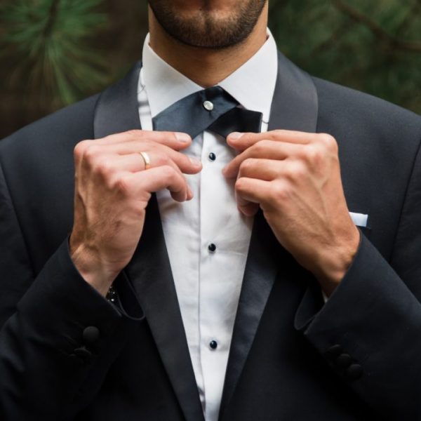 Groom at wedding tuxedo in the forest